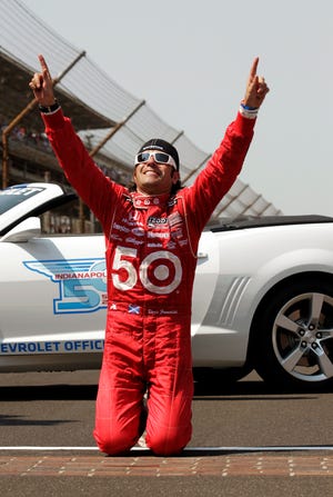 Dario Franchitti of Scotland reacts after winning IndyCar's Indianapolis 500 auto race at Indianapolis Motor Speedway in Indianapolis, Sunday, May 27, 2012.