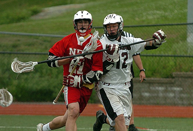 East Lyme’s Alex Hanley, right, knocks the ball loose from Norwich Free Academy’s David Cedrone during the ECC championship last week. The Vikings and Wildcats could have some potentially tough state tournament games as Fairfield County Interscholastic Athletic Conference programs dominate their respective brackets.