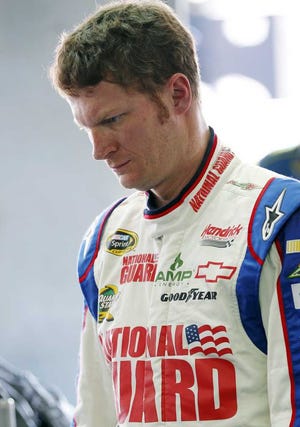 Dale Earnhardt Jr. looks at his car before practice for Sunday's NASCAR Sprint Cup Series Coca-Cola 600 auto race in Concord, N.C., Thursday, May 24, 2012. (AP Photo/Terry Renna)