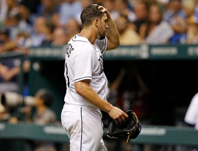 TAMPA BAY STARTER JAMES SHIELDS wipes his brow after surrendering five runs in the sixth inning that helped the Chicago White Sox break open a close game and nab a second consecutive win against the Rays. (MIKE CARLSON | THE ASSOCIATED PRESS)