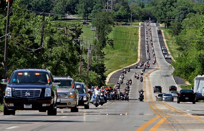 Hundreds of motorcyclists ride in the funeral procession for Michael "Scooter" Studer Wednesday, May 30, 2012, on North Springfield Avenue to Willwood Burial Park in Rockford.