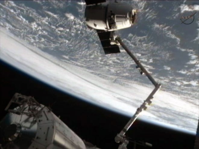 This frame grab image from NASA-TV shows the SpaceX Dragon capsule just after the capsule was released from the Canadarm2 at 5:49 this morning.