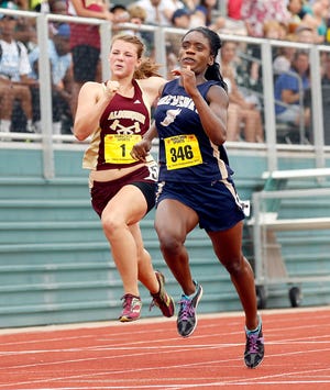 Shrewsbury's Dominque Hall, right, moves ahead of Algonquin's Megan Davis in the final 100-meter dash during Saturday's Central Mass Track Tournament at Fitchburg State University.