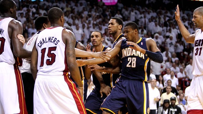 Officials work to separate Heat and Pacers players after a heated battle during the Pacers' Game 2 win.
