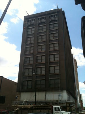 The building at 522-24 E. Monroe St. is pictured on Friday, June 1, 2012, after metal panels were removed from the facade on one side of the building.