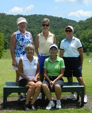 Oak Ridge Country Club members, from left, stitting, Bonnie Loring and Adria Herrman; as well as, standing, Sharon Kelly, Carolyn Singer and Cricket McKamey get set for their Couples Round on Sunday before the KAWGA Match Tournament on Monday at their home course.