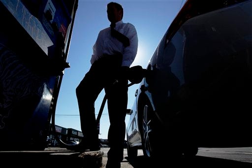 In this Feb. 16, 2011 file photo, Brian Sprague fills his his car's tank with gas in Philadelphia. Gasoline for U.S. motorists already costs more than at any point since 2008, despite ample supplies. (AP Photo/Matt Rourke, file)