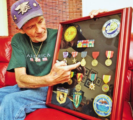 Vietnam War veteran Jim Keefe of Newmarket shows the medals he recently received, including a Purple Heart.