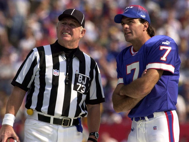 Buffalo Bills back up quarterback Doug Flutie talks with NFL back judge Bobby Skelton during a play review during the game against the Indianapolis Colts in Orchard Park, N.Y., Sunday, Oct. 1, 2000. Skelton passed away Sunday. (AP Photo/Mike Groll)