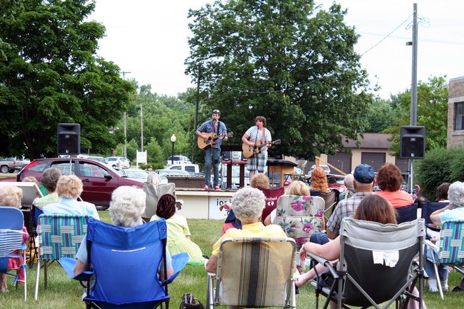 Community members enjoy a performance during one of last year’s Music on the Green concerts. This year, the concerts will take place at 7:30 p.m. Tuesdays through Sept. 8 at Ionia's First United Methodist Church, with a special Ionia Cancer Awareness Concert at 7 p.m. Sept. 23.