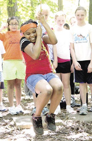 Lateria Walton, an Eastwood fifth-grader, helped the girls beat the boys in a team-building game the 
students played Monday at Camp Fort Hill. Each spring, students take part in a three-day education camp.