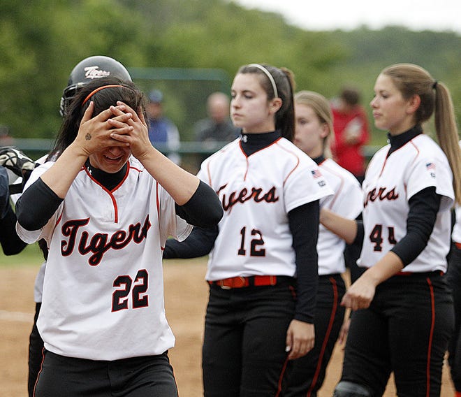 Taunton High's Meaghan Kirby (22) and her teammates leave the field after dropping a heartbreaker to No. 1 seed King Philip in Tuesday's Division I South first round game.