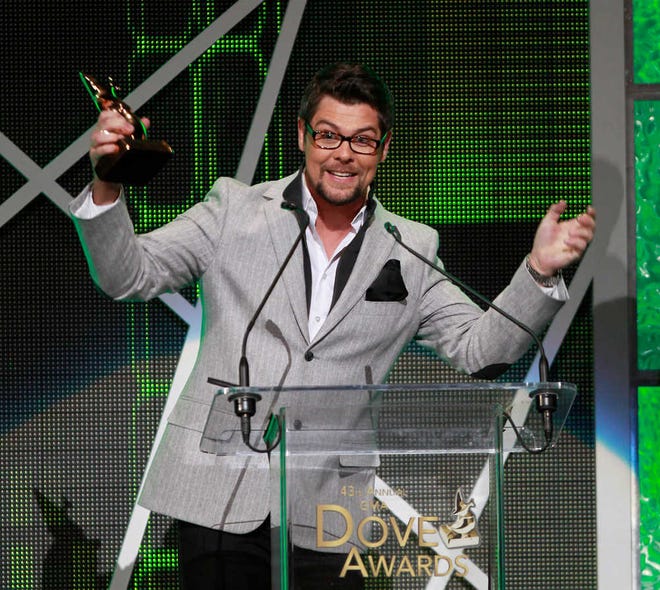 FILE - In this Thursday, April 19, 2012 file photo, Gospel singer Jason Crabb reacts after winning the Dove Award for male artist of the year during taping of the Gospel Music Association Dove Awards at Atlanta's Fox Theater. (AP Photo/John Bazemore)