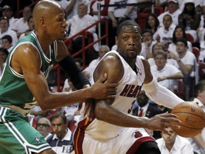 Miami Heat's Dwyane Wade (3) drives as Boston Celtics' Ray Allen defends during the first half of Game 7 of the NBA basketball playoffs Eastern Conference finals, Saturday in Miami.