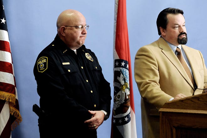 Police Chief Ken Burton, left, listens March 6 at City Hall as City Manager Mike Matthes answers questions about a report on the workplace culture of the Columbia Police Department.