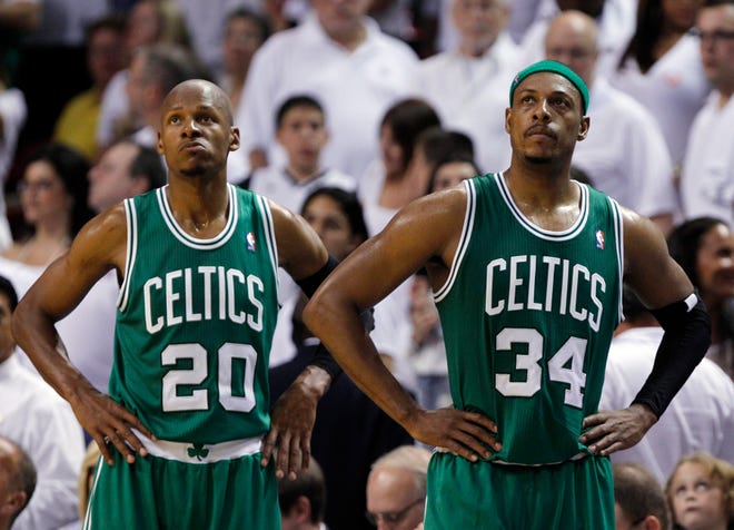 Boston Celtics' Ray Allen (20) and Paul Pierce (34) look up at the scoreboard as the Celtics fall behind the Miami Heat during the second half of Game 7 of the NBA basketball playoffs Eastern Conference finals, Saturday, June 9, 2012, in Miami. Miami won 101-88. (AP Photo/Lynne Sladky)
