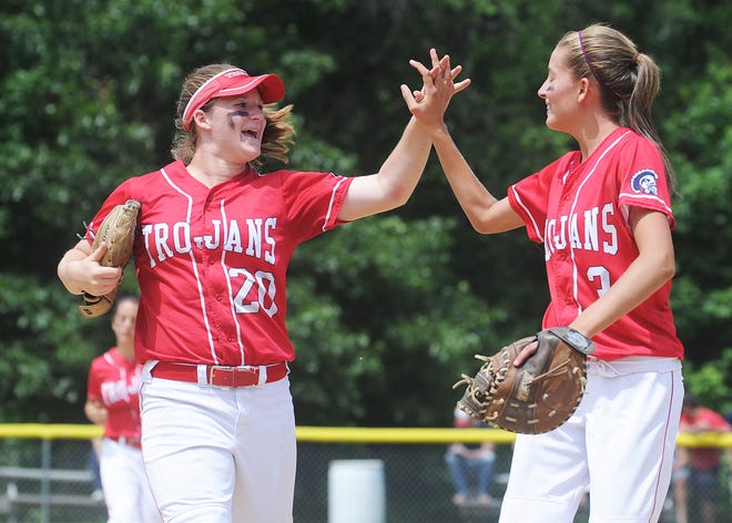 Bridgewater-Raynham teammates celebrate from left, Madison Shaw, and Kristen MacLellan, during their game, on June 9, 2012, in Taunton.