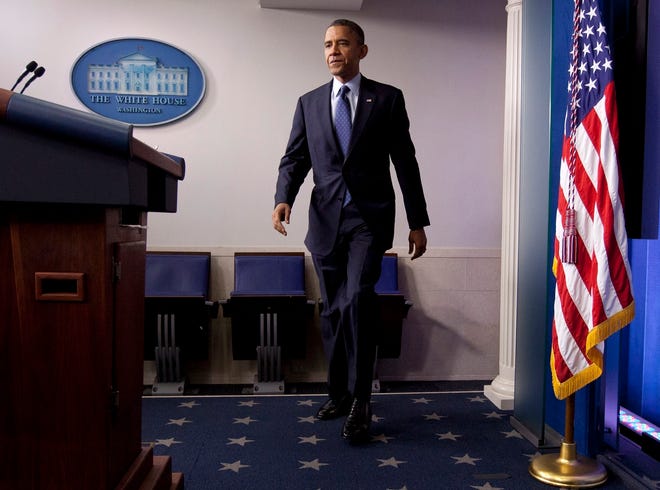 In the briefing room of the White House, President Barack Obama walks to the 
podium Friday to talk about the economy, a key issue in the 
election.ASSOCIATED PRESS / CAROLYN KASTER