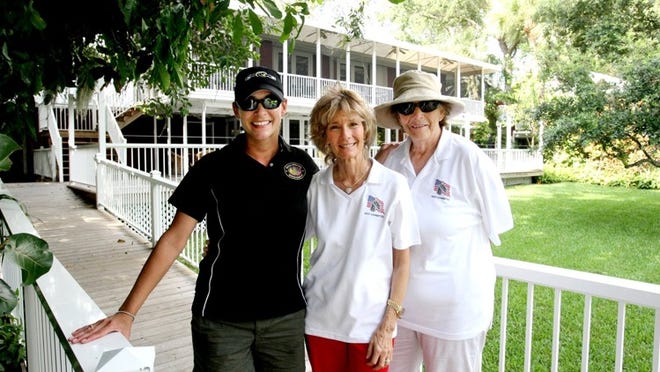 JUPITER — From left to right, Lisa Nantz, of Tampa, of the Special Forces Warrior Foundation, Sara Ashworth Lankler, of Jupiter, co-founder of the Renewal Coalition, and Mary Hinton, of Tequesta, executive director of the Renewal Coalition, meet at Lankler’s home in Jupiter on Sunday. Both organizations hosted a picnic for widows and families of servicemen killed in action as part of a retreat weekend. (Gary Coronado/The Palm Beach Post)