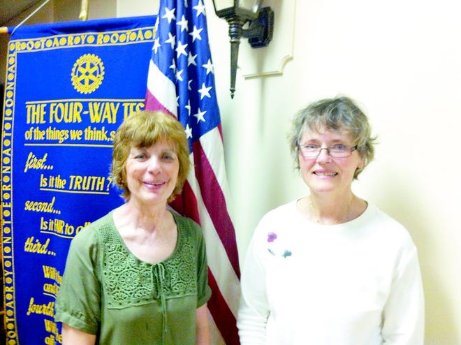 Above, Neitzert (left), talked to Noon Rotary Club members about the purpose of AABC, which served both Hillsdale and Branch counties.