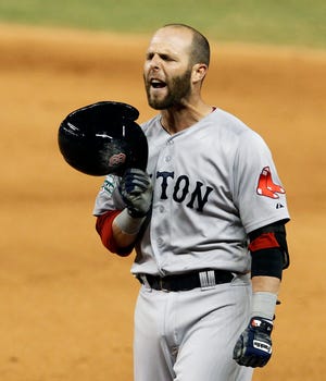 The Red Sox's Dustin Pedroia reacts after being called out at first base on a ground ball fielded by the Marlins third baseman Hanley Ramirez in the eighth inning of Monday's interleague l game in Miami.