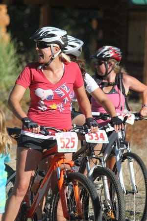Brenda Nystrom is all smiles before the start of the beginners race of the YMCA Mountain Bike Series on?Tuesday at Upper Greenhorn Park in?Yreka.
