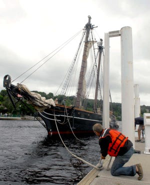 Freedom Schooner Amistad crew member Shawn McGinnis ties a line to the dock at the Norwich Marina after the Amistad traveled up the Thames River. The Amistad will be part of Norwich’s Freedom Bell weekend.