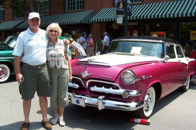 John and Lynda Guarnieri stand next to their Dodge at a car show in North Carolina in May 2010.