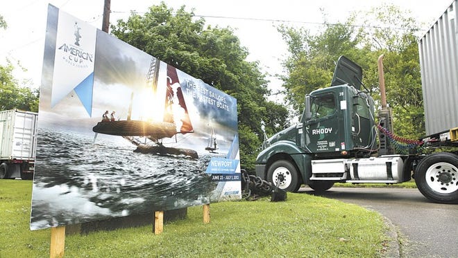 Trucks delivering equipment for the America’s Cup World Series pass the entrance of Fort Adams State Park in Newport on Wednesday.