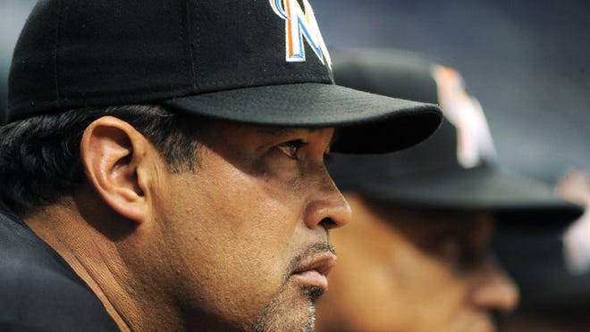Miami Marlins manager Ozzie Guillen watches from the dugout during the eighth inning of an interleague baseball game against the Tampa Bay Rays, Sunday, June 17, 2012, in St. Petersburg, Fla. The Rays won 3-0. (AP Photo/Brian Blanco)