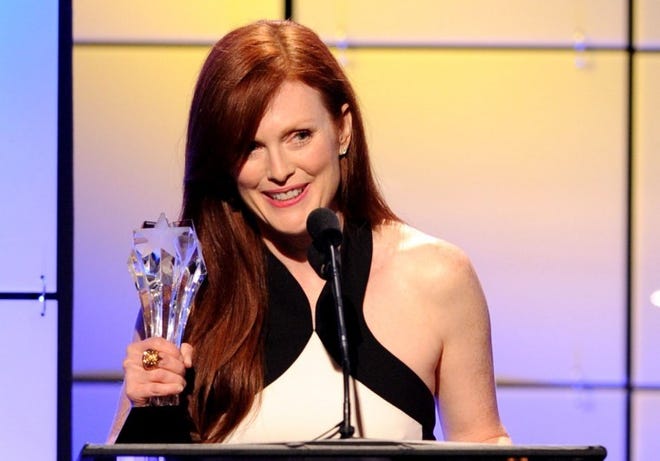 Julianne Moore accepts the award for best actress in a movie or miniseries for "Game Change" onstage at the Critics' Choice Television Awards at the Beverly Hilton Hotel on Monday, June 18, 2012 in Beverly Hills, Calif. (Photo by Vince Bucci/Invision/AP)