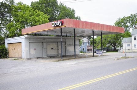 The former gas station at the corner of Islington and Cabot streets in Portsmouth will go up for auction in August.