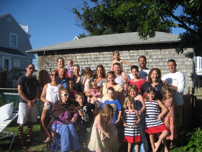 Amy Ferguson (in the middle of the picture in the back row holding the little girl) and Team Gonzee on Father’s Day. Amy’s father, John Bergonzi, is third row, third from left.