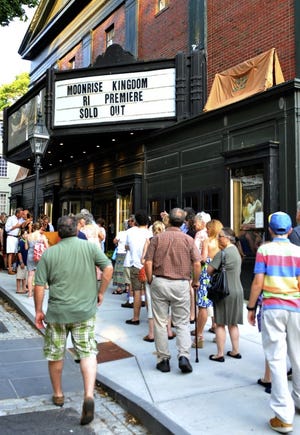 Moviegoers wait in line to enter the Jane Pickens Theater in Newport for the public Rhode Island premiere of ‘Moonrise Kingdom.’ Much of the movie, which was directed by Wes Anderson, was filmed in the Ocean State. The event at the Pickens included a pre-show party featuring picnic food.