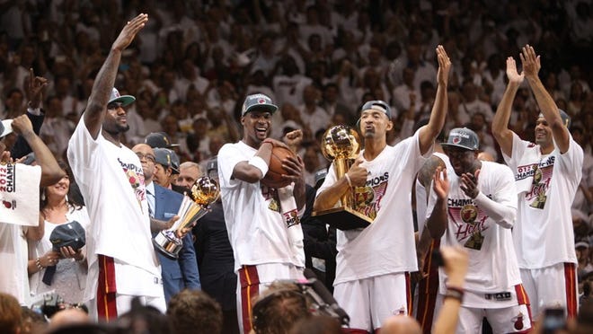 Heat players celebrate after beating the Thunder in game five of the NBA Finals at the AmericanAirlines Arena in Miami on Thursday. (Gary Coronado/The Palm Beach Post)