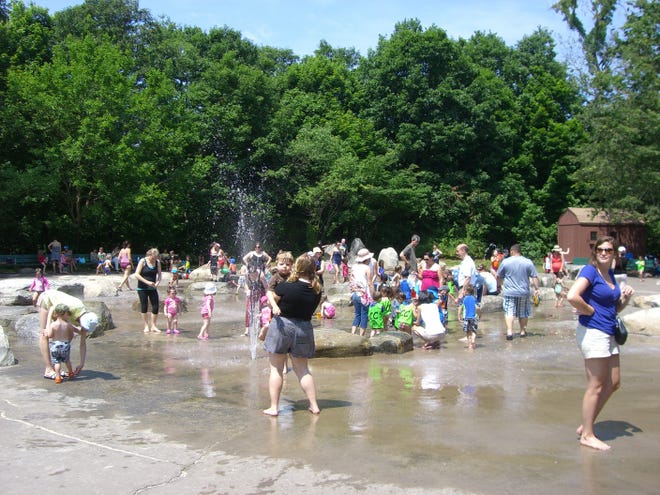 Cooling off during the heatwave on June 22 at the Beaver Brook Reservation Spray Deck in Belmont.
