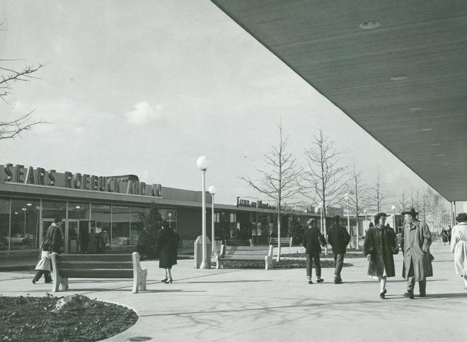 Shoppers stroll the open air Levittown Shopping Center that once housed 60 stores in the 1950’s , near the intersection of Route 13 and the Levittown Parkway.