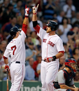 Will Middlebrooks celebrates his solo home run with Cody Ross (7) in the third inning of the Red Sox' 8-4 victory over the Braves on Saturday night at Fenway Park.