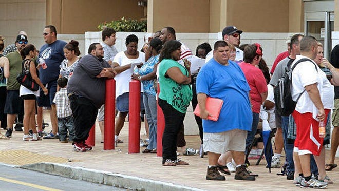 Hopefuls line up to try out for NBC's "The Biggest Loser," which started the process for casting season 14 in South Florida on Saturday June 23, 2012. This is part of a 13-city cross-country search to find new contestants for the next edition of the hit show, to air in January 2013. The casting call was at Planet Fitness in north Miami-Dade County. MARSHA HALPER / Miami Herald Staff