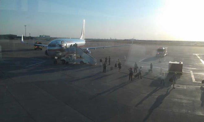 Passengers depart a Boeing 737 on Monday after it landed in Amarillo.
