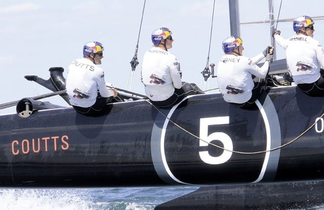 Oracle Team USA — Coutts goes for a practice run Sunday on Narragansett Bay. Skipper Russell Coutts is at the far left.