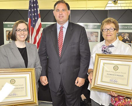 Congressman Frank Guinta presents Jennifer Turco Beaudet of Goffstown, left, and Florence "Flossie" Wiggin of Stratham, right, with the first Granite State Beacon Award. The award was presented during the Women's Job Fair hosted by Guinta in Manchester June 25.