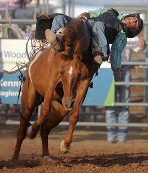 Noah Martin of Amarillo competes aboard I'm No Angel in bareback bronc riding during the 2011 Will Rogers Range Riders Rodeo.