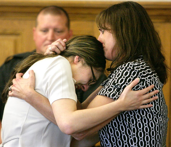 Following the guilty verdict being read, a family member (right) gives Shanna Simon a hug before she was taken back to jail.