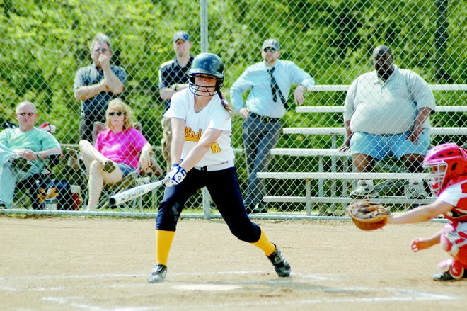 Hillsdale’s Kim Sanderson takes a swing against Coldwater Thursday afternoon.