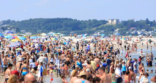 Thousands of people take advantage of the sun and hot weather to enjoy Crane Beach.