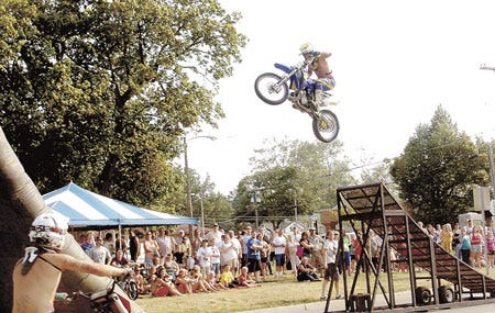 BMX stunt rider Cody Cavanaugh soars high above East Chicago Road at the Sturgis Fest “Bike Night,”?held Thursday.
