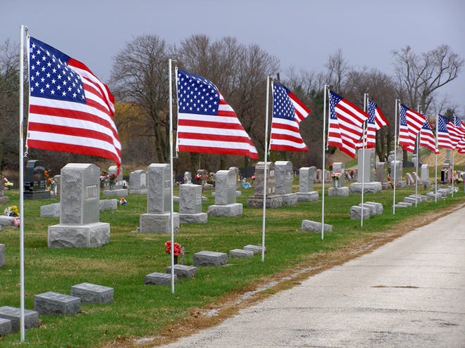 Flags fly on patriotic holidays at Rosedale Cemetery in rural Cambridge.