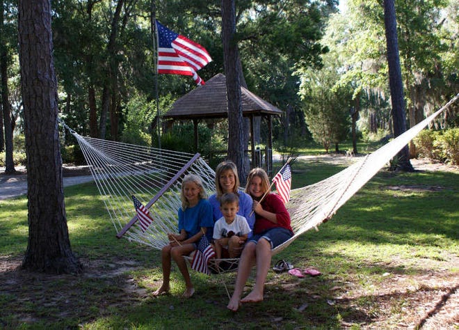 Californian Karen Robbins with children Emily, Cooper and Molly celebrate the 4th of July South Carolina Lowcountry style in her Grammy's hammock on the banks of the Stoney Creek.