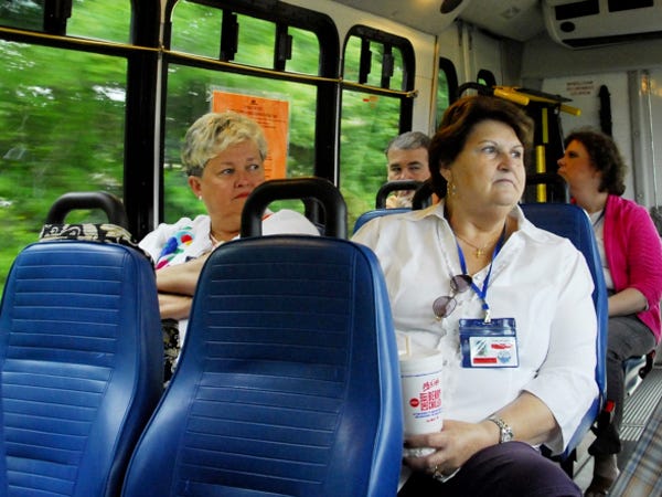 Leland town council members, Jane Crowder, left, and Martha Currie hear the concerns of pedestrians who rely on transportation provided by Wave Transit. Brunswick County and the northern towns are trying to decide whether to keep paying Wave Transit to operate the Brunswick Connector as prices have gone up.